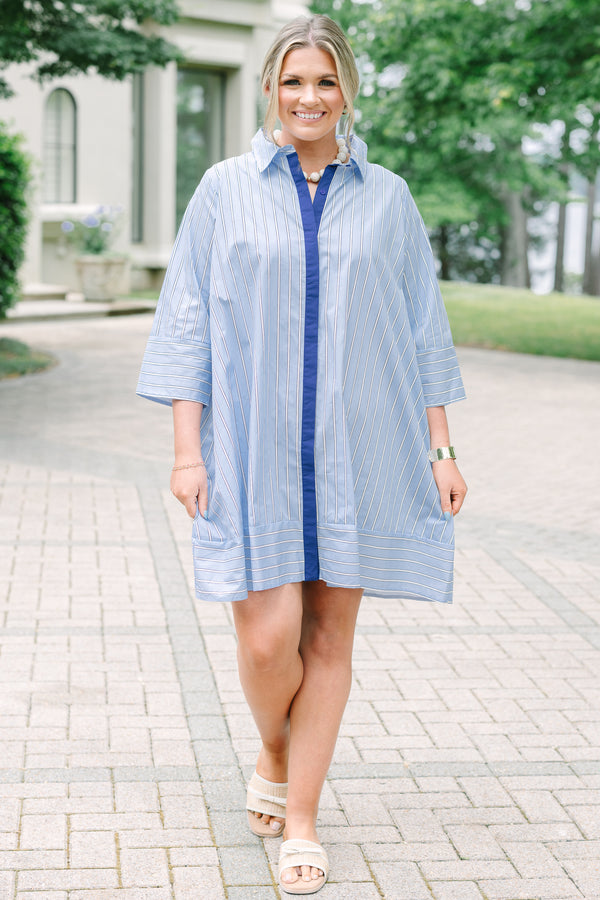 Plus size blue and white striped cotton shirt dress with three-quarter sleeves and a navy button placket.