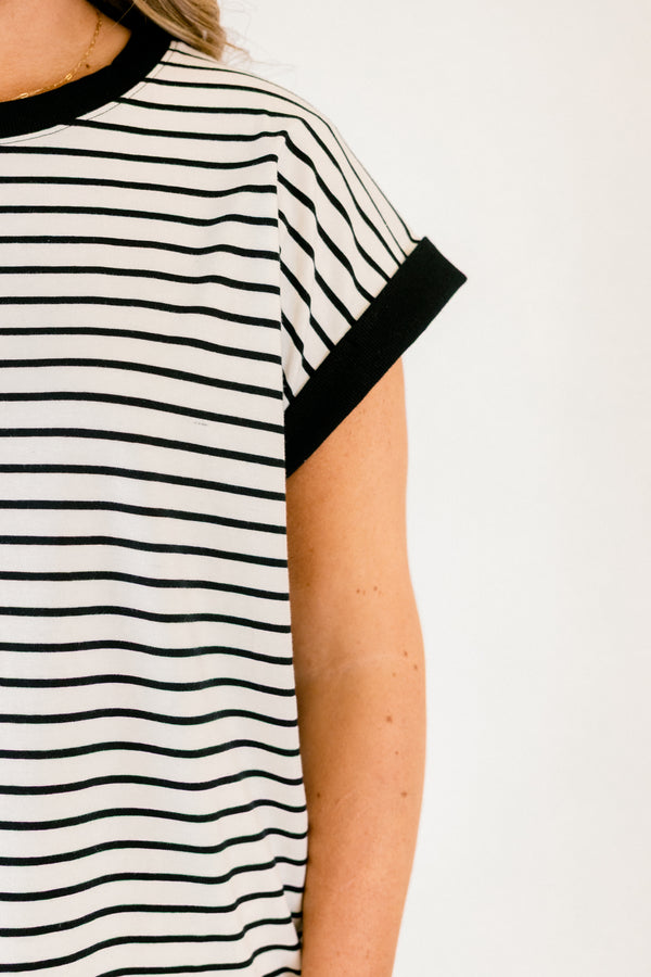 Chic Soul plus size clothing, cream short sleeve tee with black stripes as well as black cuffs at the end of each sleeve and black outlining the neckline of the tee 
