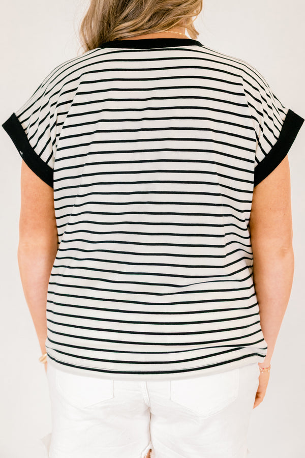 Chic Soul plus size clothing, cream short sleeve tee with black stripes as well as black cuffs at the end of each sleeve and black outlining the neckline of the tee 
