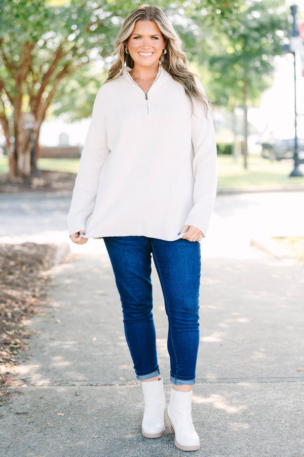 Plus size cream ribbed quarter-zip sweater with a cozy, relaxed fit and long sleeves.