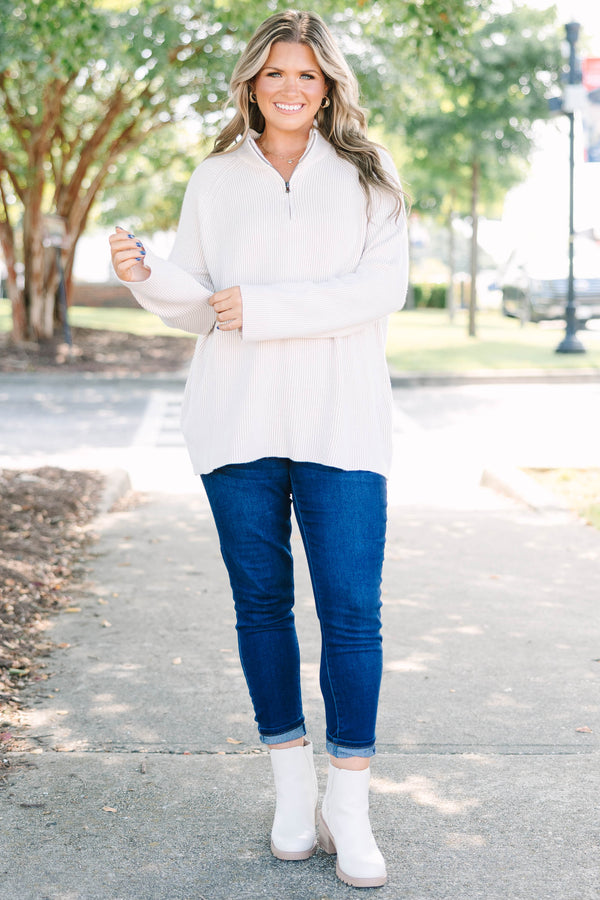 Plus size cream ribbed quarter-zip sweater with a cozy, relaxed fit and long sleeves.