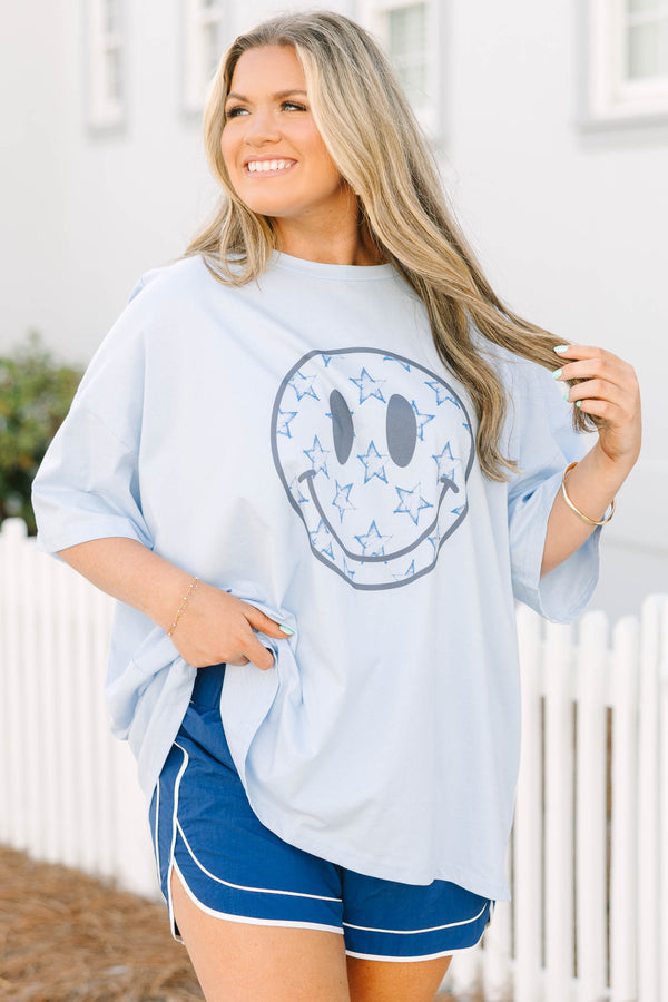 Chic Soul plus size clothing, light blue short sleeve boyfriend tee with light grey smiley face on the front of the tee with darker blue star outlines inside of the smiley face
