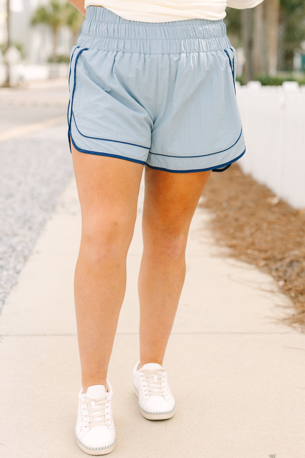 Chic Soul plus size clothing, blue athletic shorts with a stretchy high waistband as well as a darker blue outlining the bottom of the shorts and up the sides 