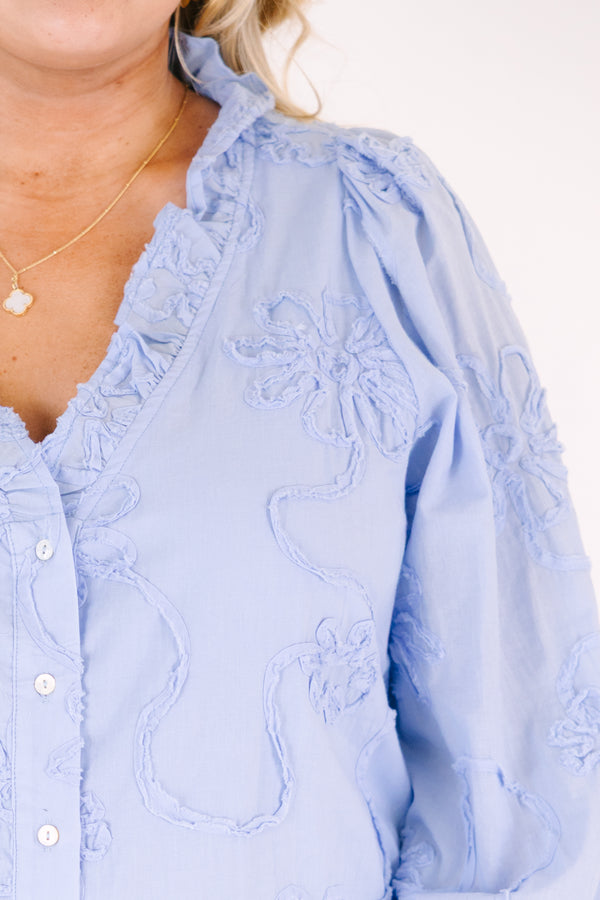 Chic Soul plus size clothing, long sleeve blue top with a deep v-neckline and textured floral pattern throughout as well a cinching at the bottom of the sleeves 