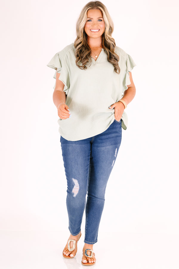 Chic Soul plus size clothing, medium wash skinny jeans with distressed details and a triple-button waist.