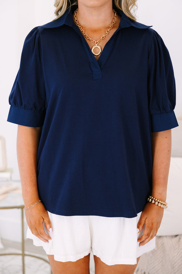 Plus Size navy blue short-sleeve top with a collared V-neckline and puffed sleeves.