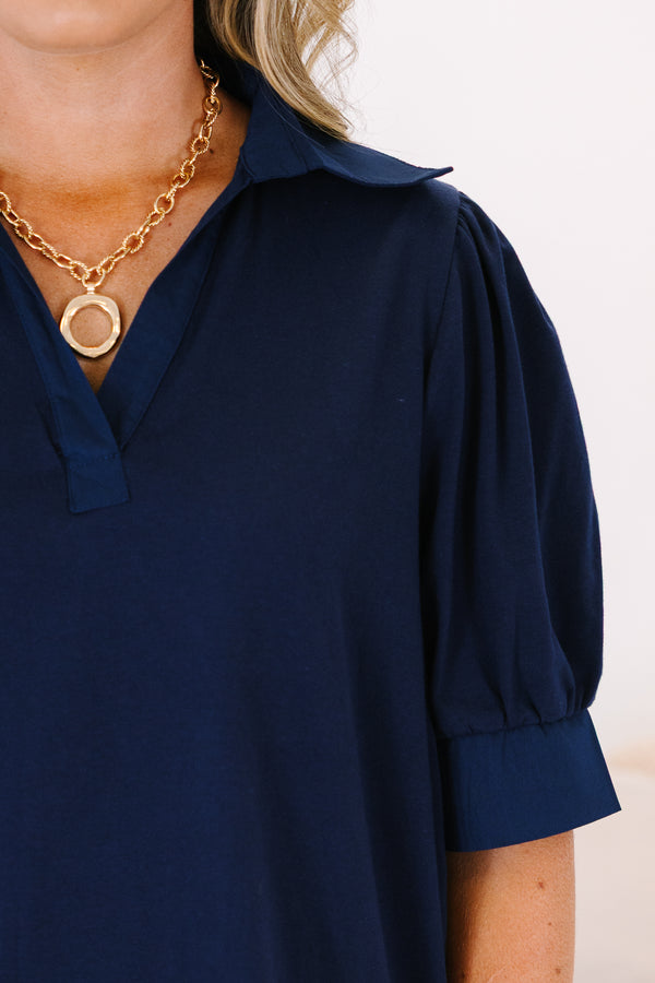 Plus Size navy blue short-sleeve top with a collared V-neckline and puffed sleeves.