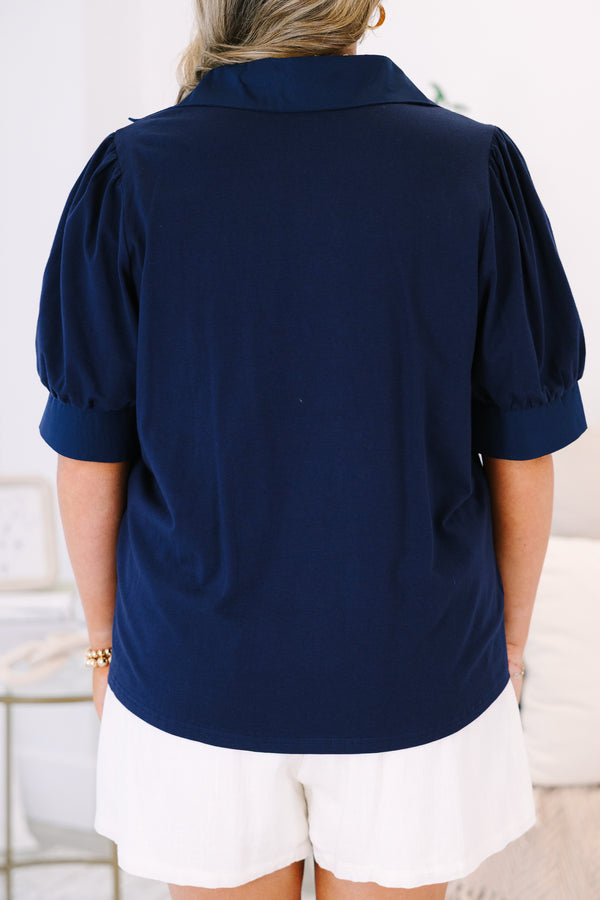 Plus Size navy blue short-sleeve top with a collared V-neckline and puffed sleeves.