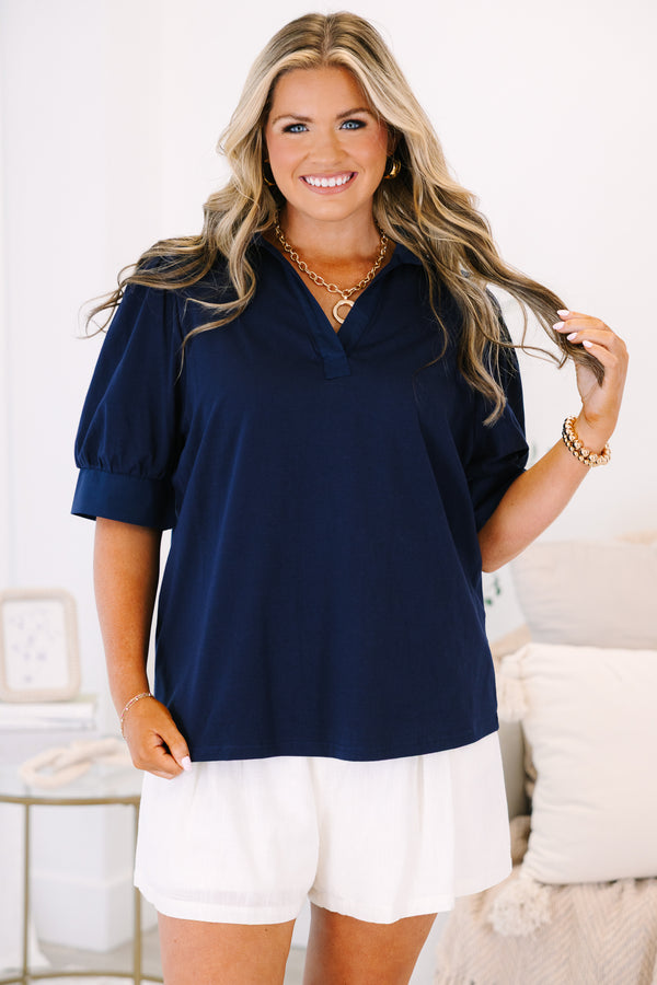 Plus Size navy blue short-sleeve top with a collared V-neckline and puffed sleeves.