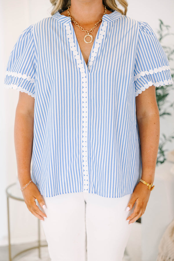Plus size blue and white striped top with white lace trim, short puff sleeves, and a flowy fit.