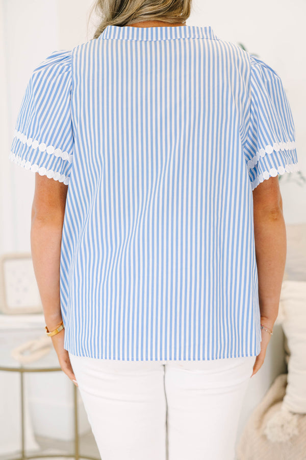 Plus size blue and white striped top with white lace trim, short puff sleeves, and a flowy fit.