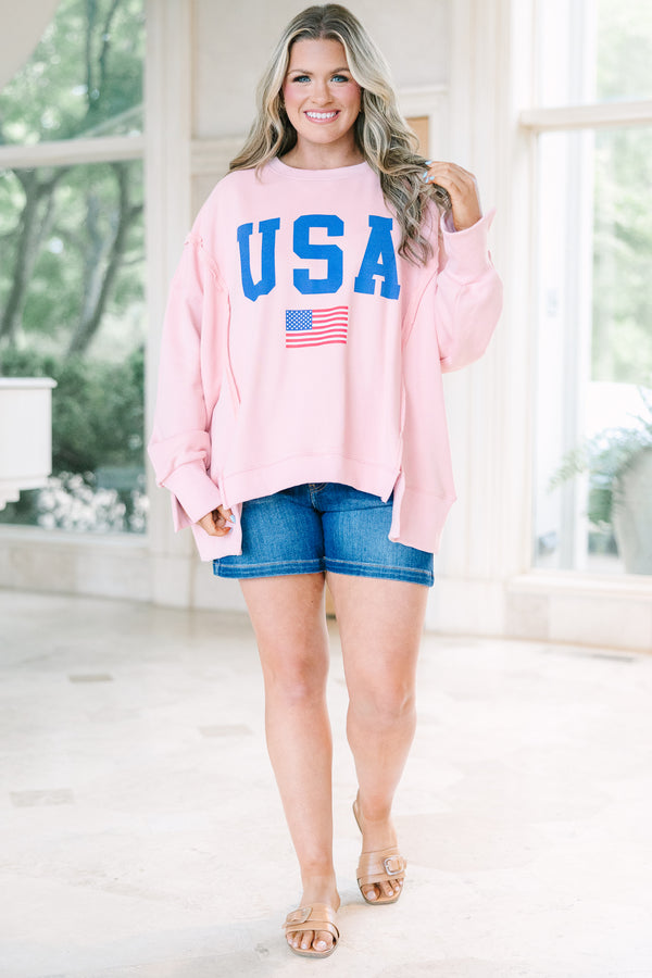 Plus Size dusty pink crew neck sweatshirt with blue USA text and an American flag graphic.