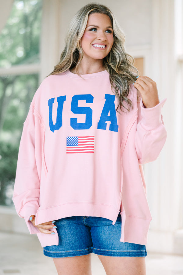 Plus Size dusty pink crew neck sweatshirt with blue USA text and an American flag graphic.