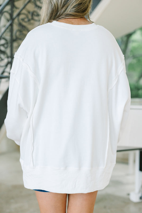 Chic Soul plus size clothing, a loose fitted ivory crew-neck shirt with long drop shoulder sleeves and exposed princess seams. Features a USA graphic with blue text and a small American flag at center front. 