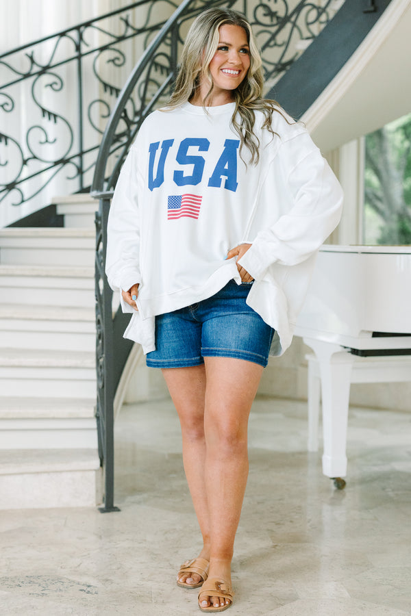 Chic Soul plus size clothing, a loose fitted ivory crew-neck shirt with long drop shoulder sleeves and exposed princess seams. Features a USA graphic with blue text and a small American flag at center front. 