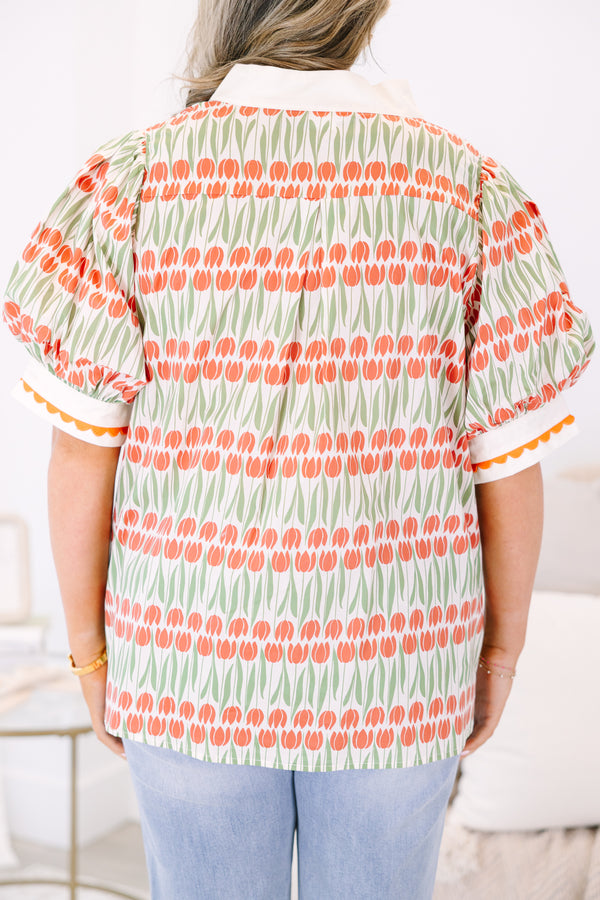 Plus Size orange and green tulip print tunic top with puff sleeves and scalloped trim.