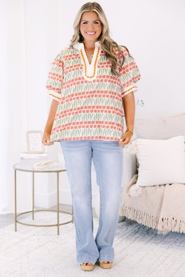 Plus Size orange and green tulip print tunic top with puff sleeves and scalloped trim.