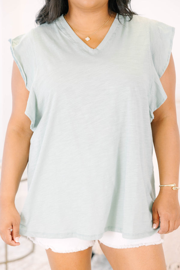 Plus Size light sage v-neck top with ruffled cap sleeves and a relaxed fit.