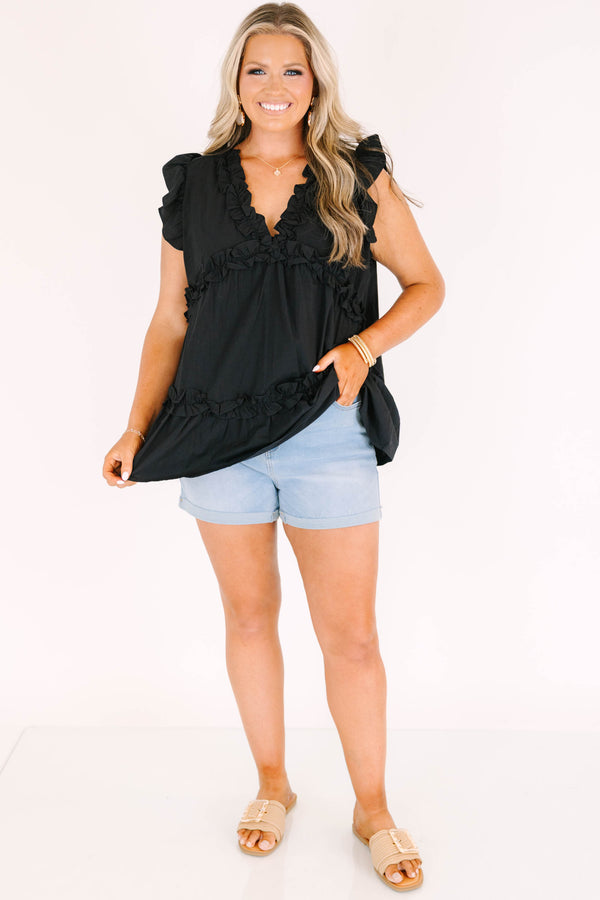 Plus size light wash denim shorts with a high-waisted fit, cuffed hem, and stretchy fabric.