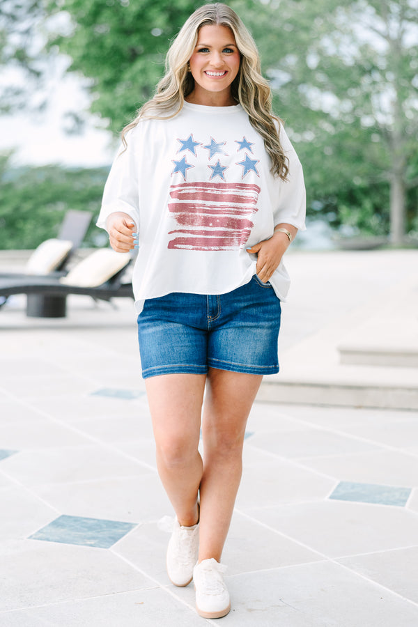 White vintage wash tee with a distressed USA flag graphic, raw-edge sleeves, and an unfinished hem.