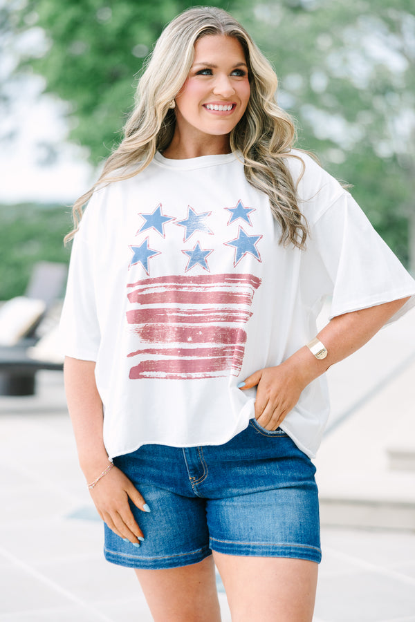 White vintage wash tee with a distressed USA flag graphic, raw-edge sleeves, and unfinished hem.