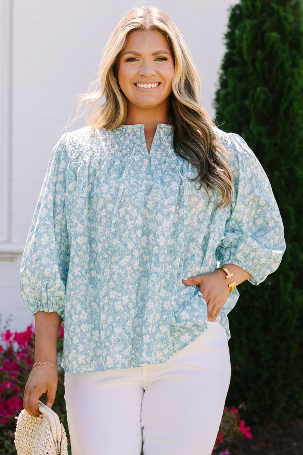 Chic Soul plus size clothing, blue top with half bubble sleeves a small v-neckline and a floral pattern throughout 