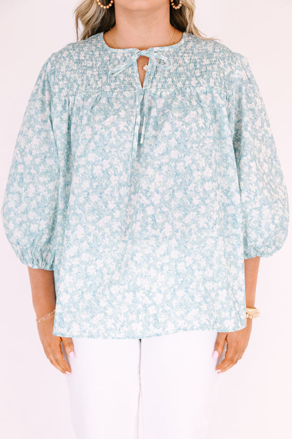 Chic Soul plus size clothing, blue top with half bubble sleeves a small v-neckline and a floral pattern throughout 