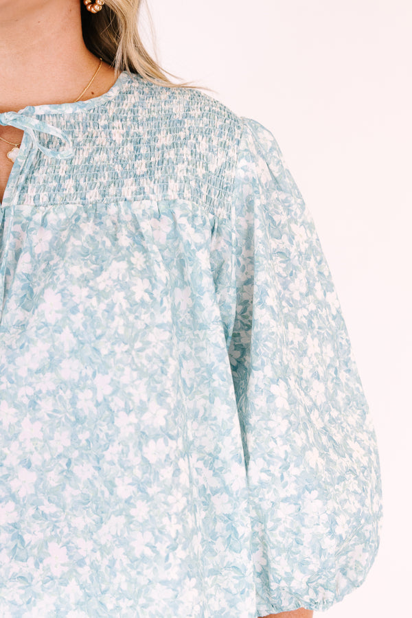Chic Soul plus size clothing, blue top with half bubble sleeves a small v-neckline and a floral pattern throughout 