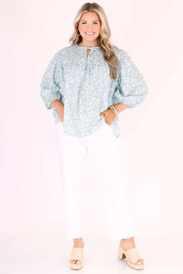 Chic Soul plus size clothing, blue top with half bubble sleeves a small v-neckline and a floral pattern throughout 