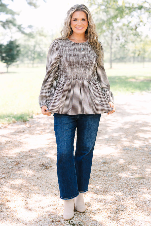 Plus Size brown gingham top with a smocked bodice, long sleeves, and a peplum hem.
