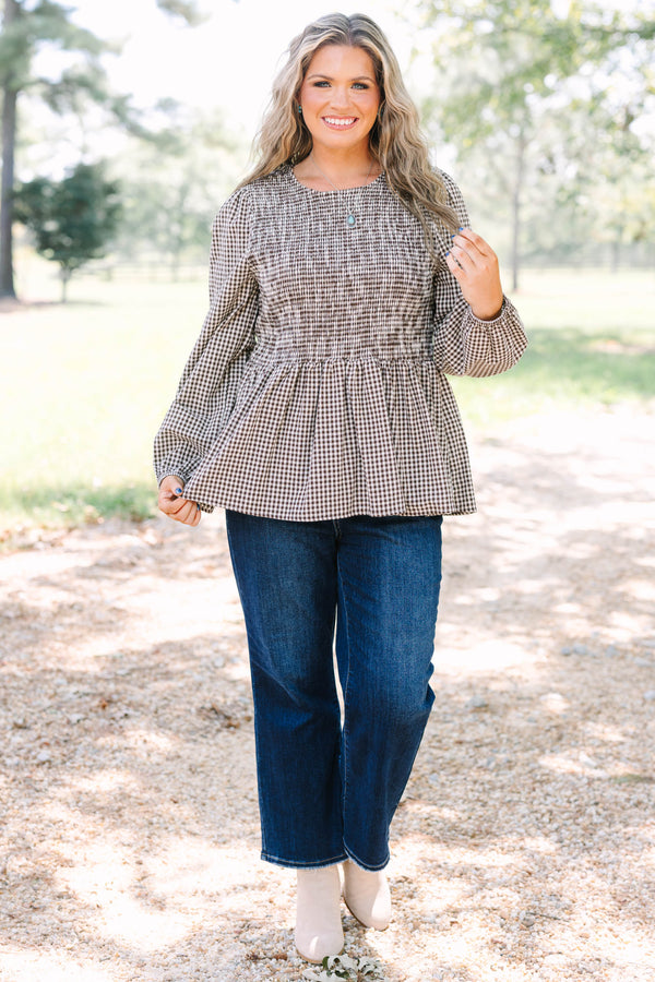 Plus Size brown gingham top with a smocked bodice, long sleeves, and a peplum hem.