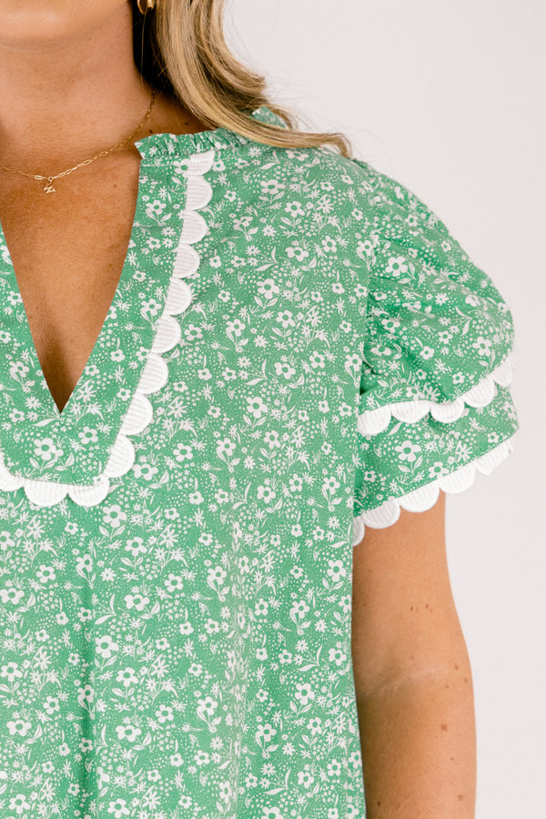 Chic Soul plus size clothing, green and white floral print short sleeve top with white scallop trim along the bottom of the sleeves and bordering the v-neckline