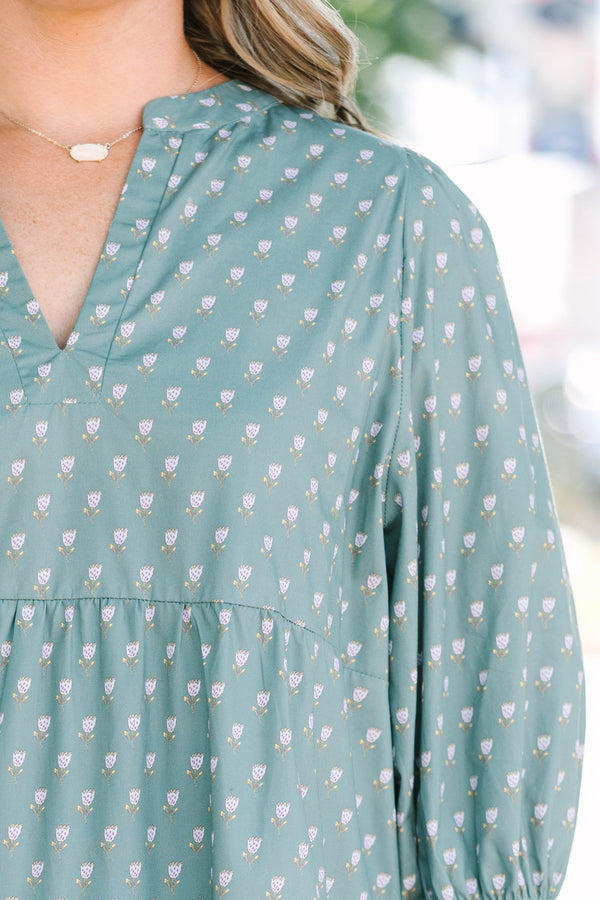 Plus Size green babydoll dress with a split v-neck, mini bell sleeves, and a floral polka dot print.