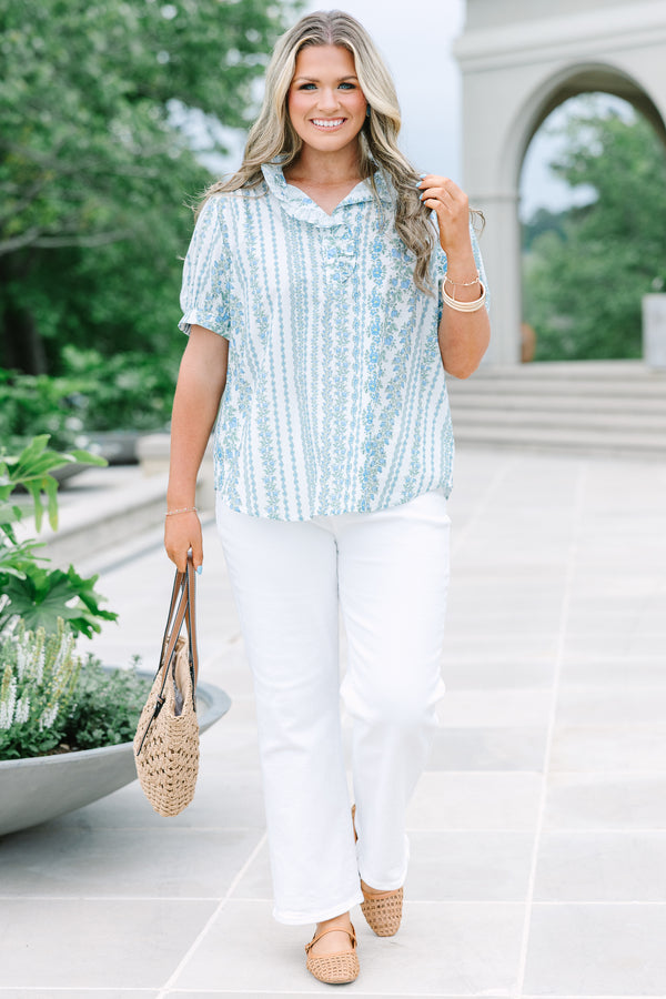 Short-sleeve blue and white floral stripe top with a ruffled button neckline.