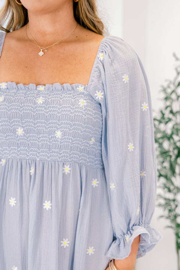 Chic Soul plus size clothing, blue tiered maxi dress with long sleeves that have a ruffle detail at the end of the sleeve and white stitched florals throughout as well as a square neckline
