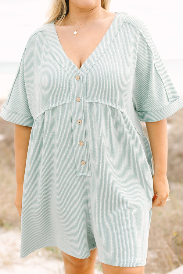 Chic Soul plus size clothing, dusty sage romper with short sleeves that have cuffs at the end of each sleeve as well as buttons going down to the mid stomach area a v-neckline and ribbed texture throughout the romper 