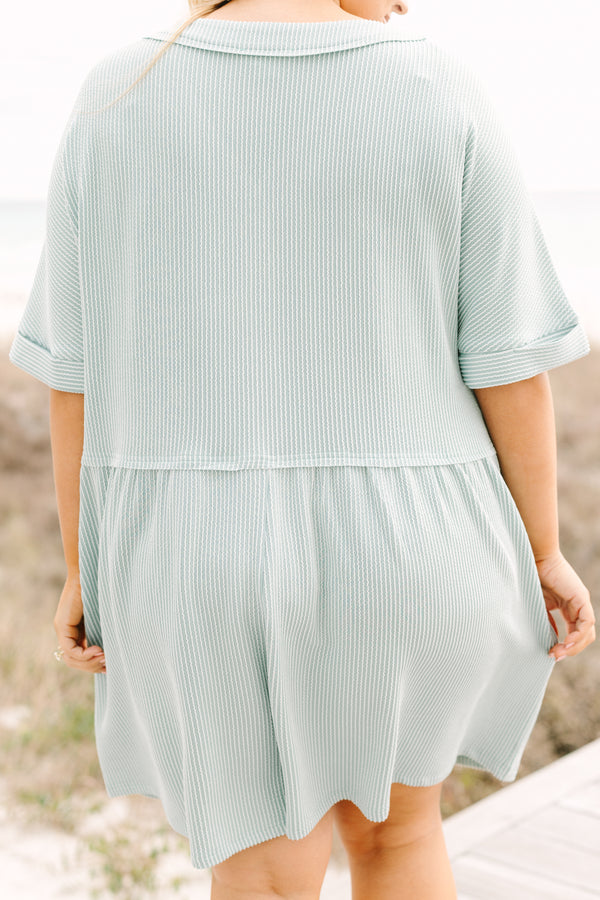 Chic Soul plus size clothing, dusty sage romper with short sleeves that have cuffs at the end of each sleeve as well as buttons going down to the mid stomach area a v-neckline and ribbed texture throughout the romper 