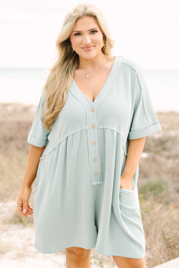 Chic Soul plus size clothing, dusty sage romper with short sleeves that have cuffs at the end of each sleeve as well as buttons going down to the mid stomach area a v-neckline and ribbed texture throughout the romper 