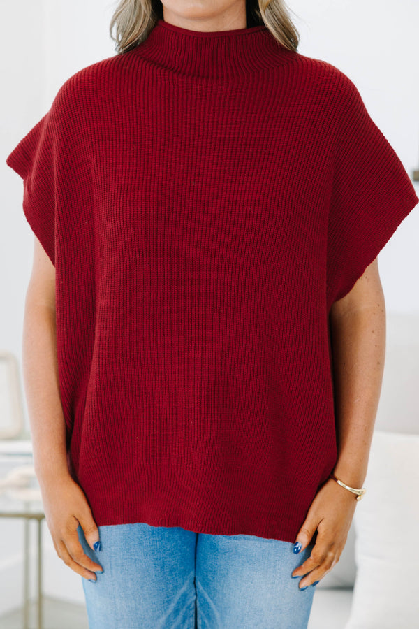 Plus size wine red mock neck sweater with cap sleeves and a relaxed knit fit.