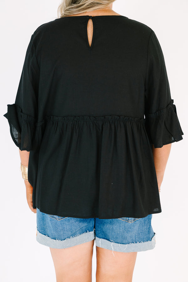 Plus Size black babydoll top with ruffled three-quarter sleeves and a round neckline.