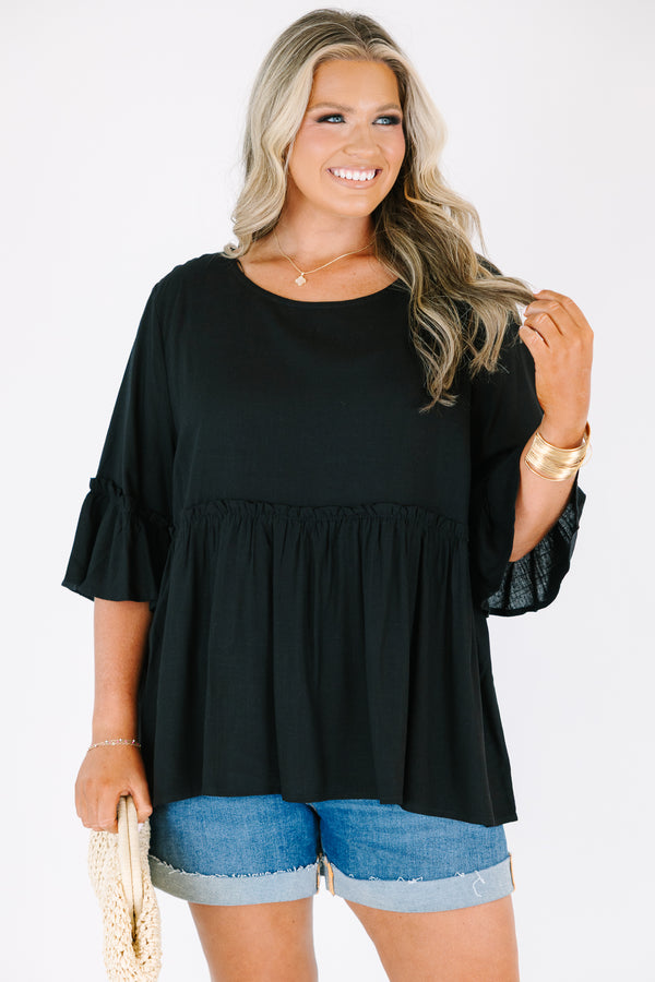Plus Size black babydoll top with ruffled three-quarter sleeves and a round neckline.