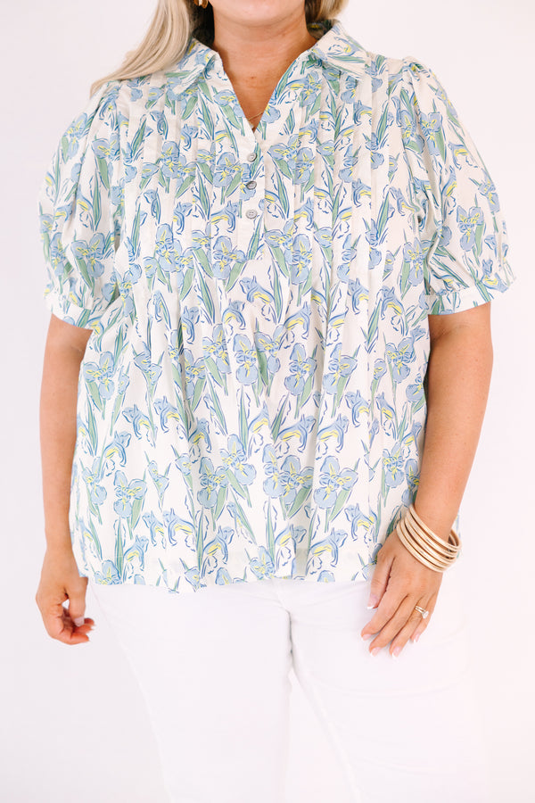 Chic Soul plus size clothing, light blue, green, and yellow floral patterned short puff sleeve top with v neckline and 3 buttons coming down from the neckline
