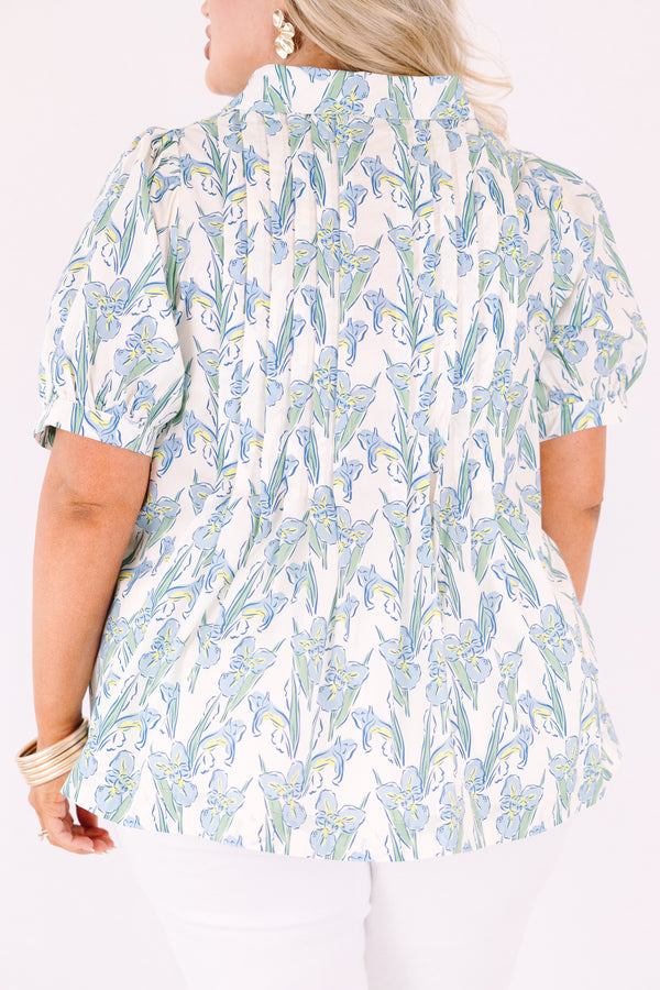 Chic Soul plus size clothing, light blue, green, and yellow floral patterned short puff sleeve top with v neckline and 3 buttons coming down from the neckline
