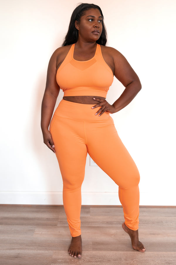 Chic Soul plus size clothing, coral orange leggings with mesh detailing and pockets