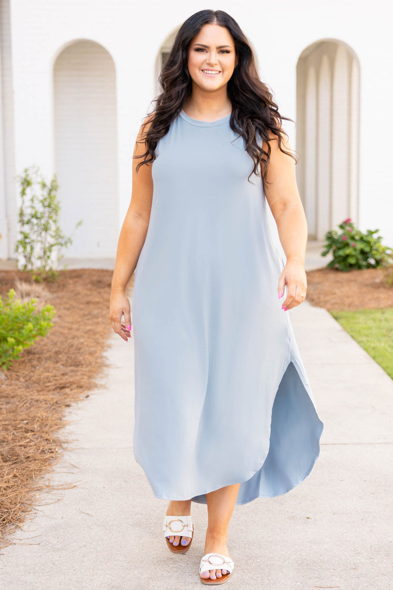 flowy neutral maxi dress Soft. Effortless. Unforgettable. This is the kind of dress that doesn't need an occasionit creates one. Flowy, feminine, and beautifully open in the back, it moves with you from vacation nights to