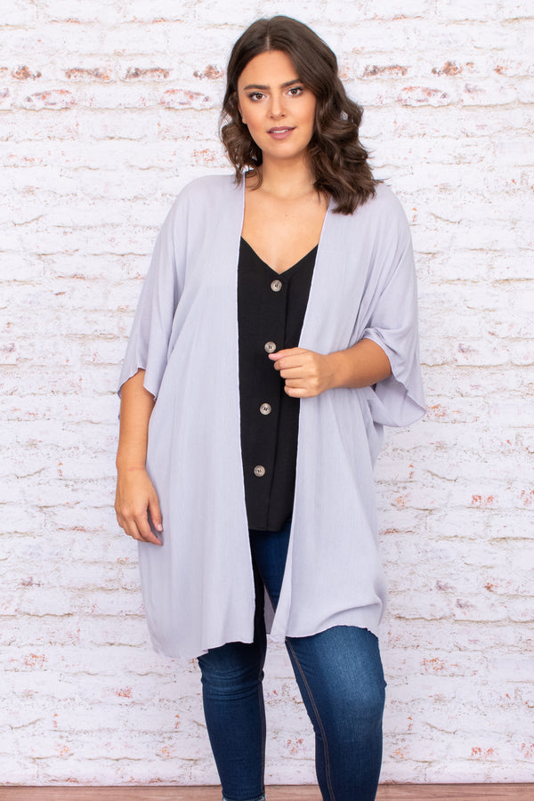 Plus Size grey open-front kimono with oversized fit and wide sleeves over a black button-up top.