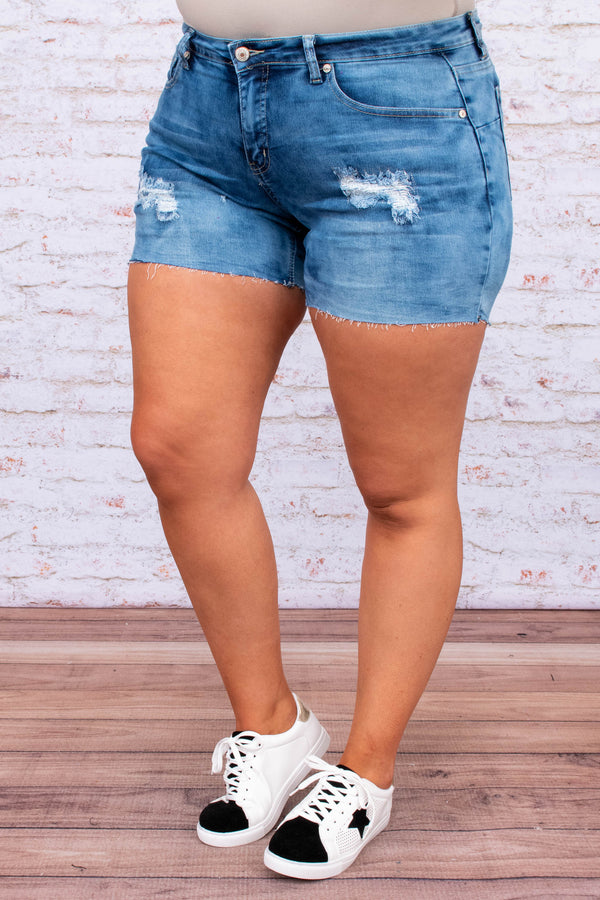 pants, shorts, above the knee, medium wash, blue, distressed, raw hem, tears, ripped