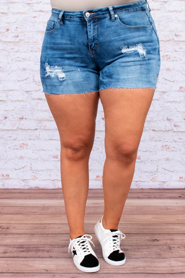 pants, shorts, above the knee, medium wash, blue, distressed, raw hem, tears, ripped