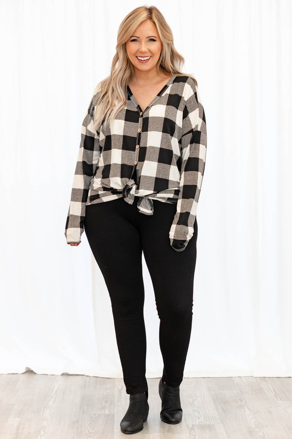 Chic Soul plus size clothing long sleeve top with black and white plaid design. It is button down in the front. 