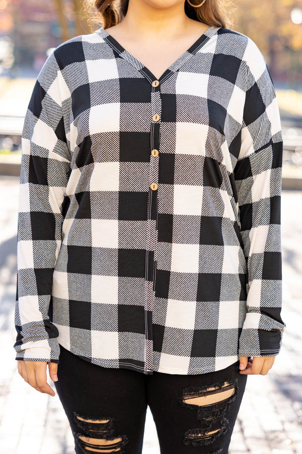 Chic Soul plus size clothing long sleeve top with black and white plaid design. It is button down in the front. 